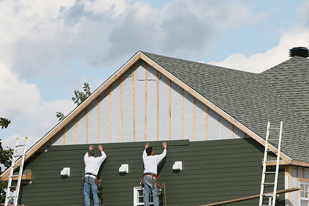 Professional Storm Damage Siding Repair technician working in Woodstock, MD